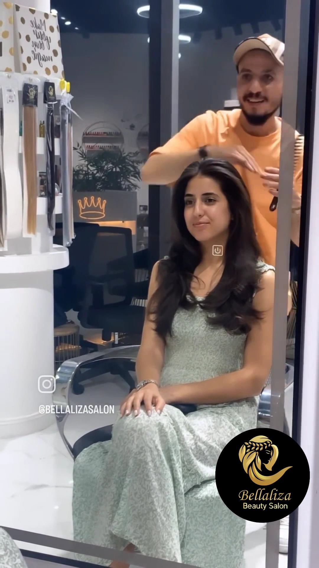 A Bellaliza stylist with a client in the salon chair